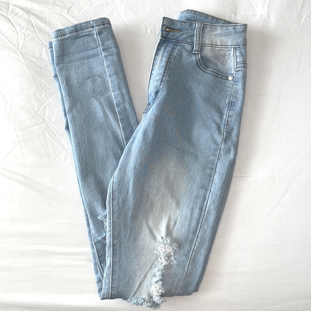 Super high waisted light denim distressed jeans